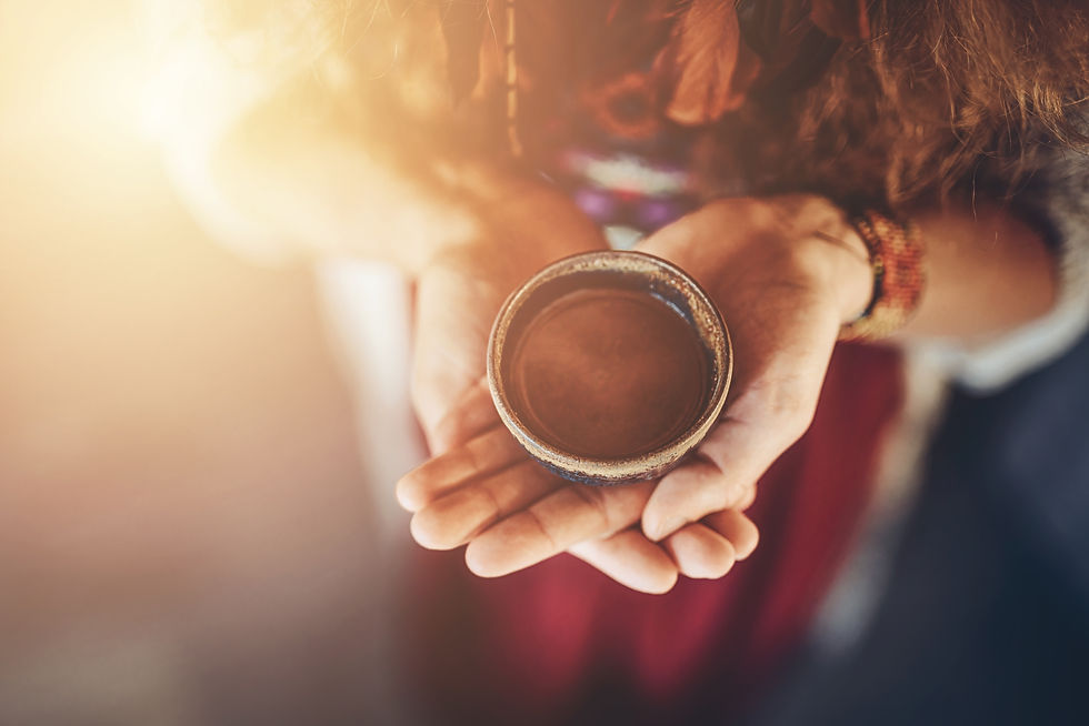 Cacao ceremony, heart opening medicine. Ceremony space. Cacao cup in woman's hand..jpg