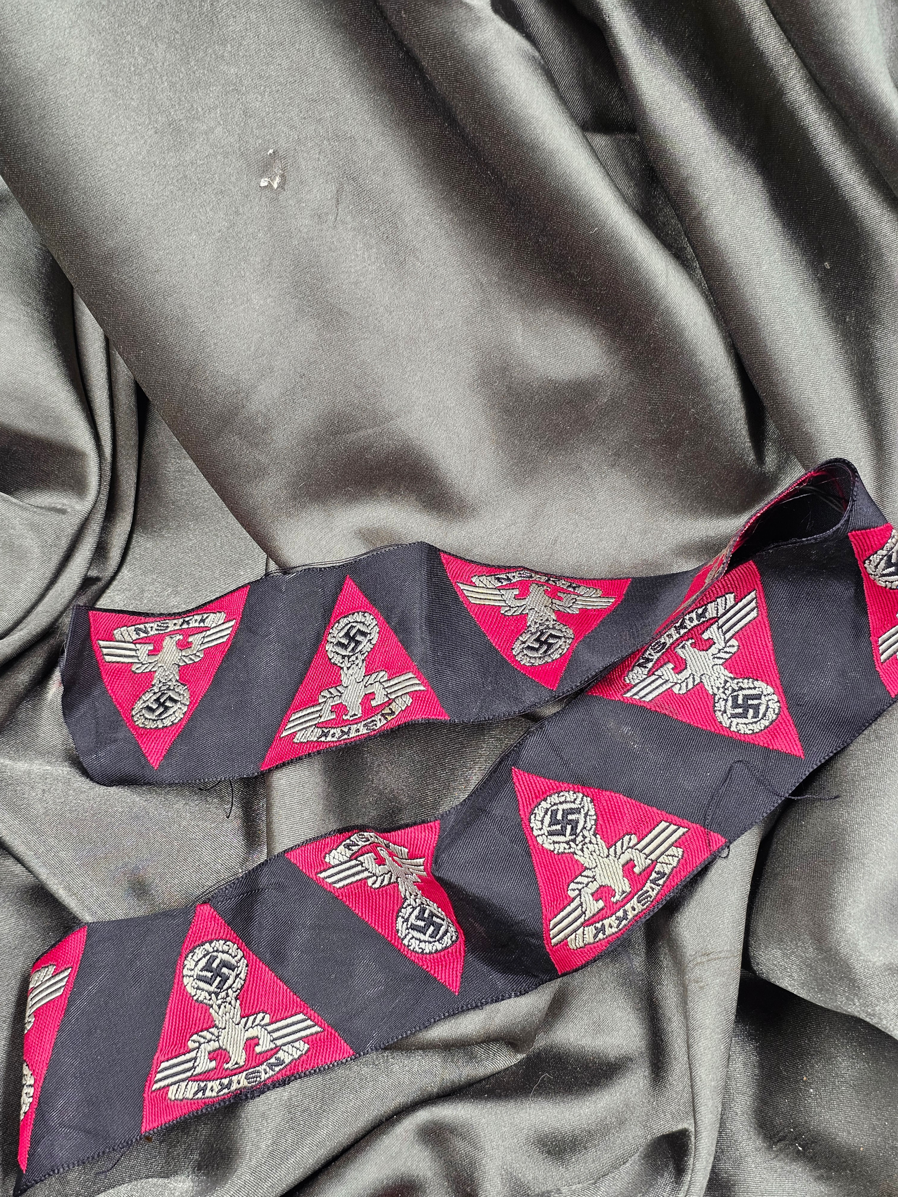 WWII GERMAN ROLL OF NSKK CAP EAGLE