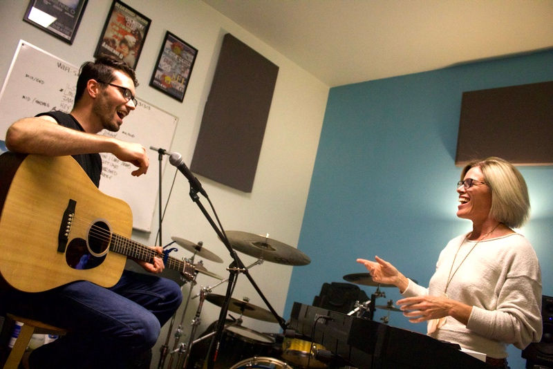 guy taking guitar lesson
