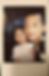 Two happy children posing for a polaroid photo.