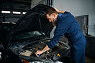 male-mechanic-working-auto-repair-shop-car.jpg