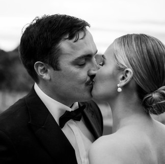 Black and white photo of a couple sharing a kiss  - Anima Visual, Wedding photography in the Gold Coast