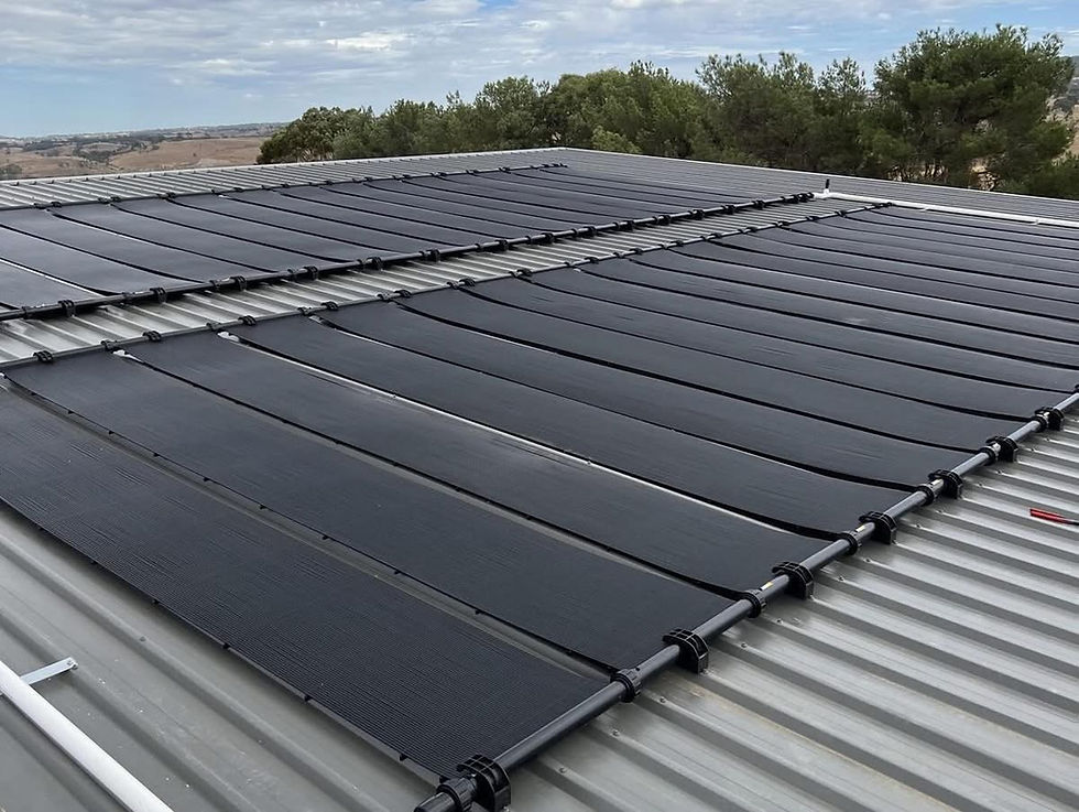Zane Gulfpanel solar pool heating collectors on a corrugated iron roof