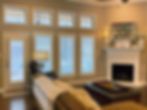 White plantation shutter window treatments in a living room