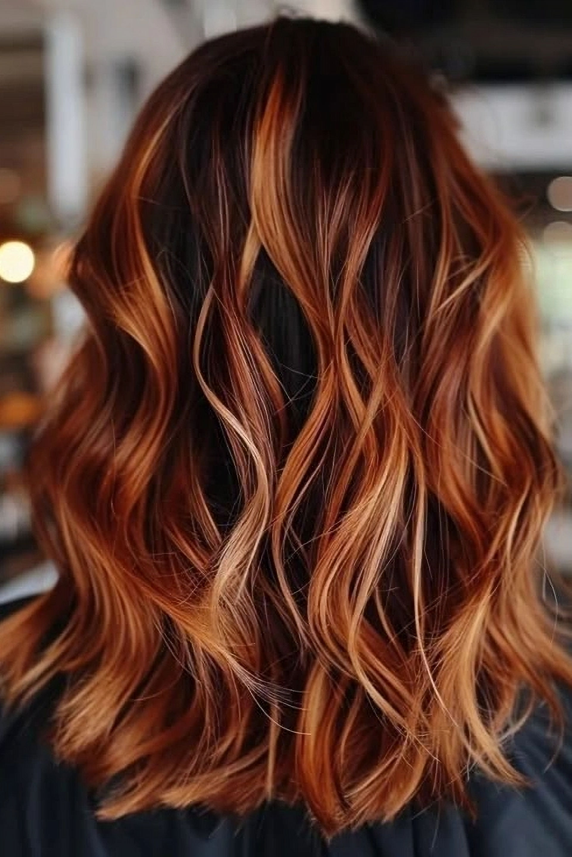 Auburn hair with hand painted copper balayage highlights
