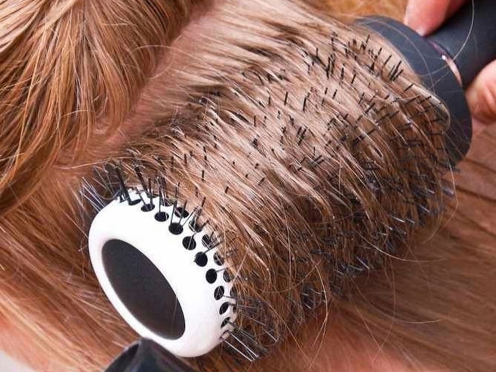 sectioned hair with. around brush for blowing out