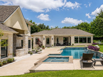 Completed detached guest house in a residential backyard with finished exterior, clean construction details, and move-in-ready condition.