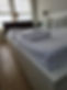 White towels neatly folded on bed