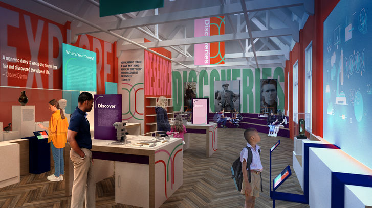 Gallery with large bold colours and text. Visitors looking at surrounding displays.