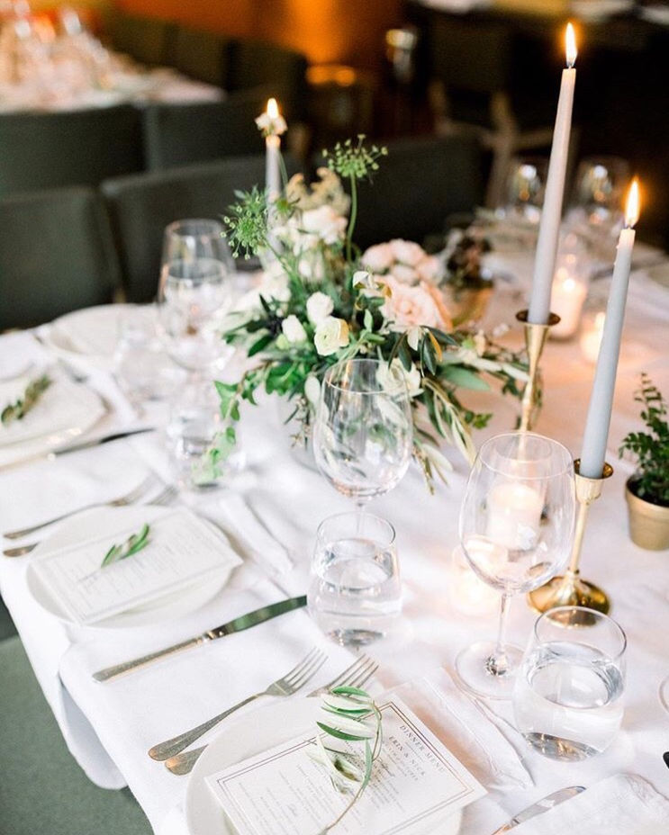 Earthy wedding centerpiece with taper candles