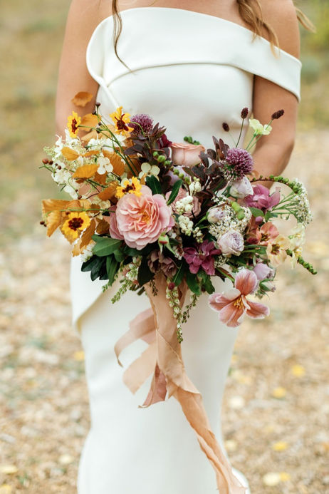Bride with wild-styled wedding bouquet