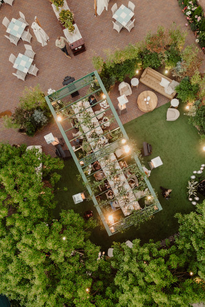View of wedding reception and custom built structure over head table