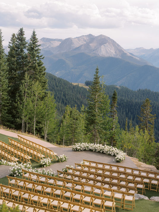 White and green mountain ceremony space at Little Nell wedding deck