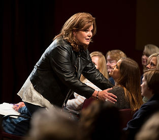 Lisa Harper speaking to a group of people