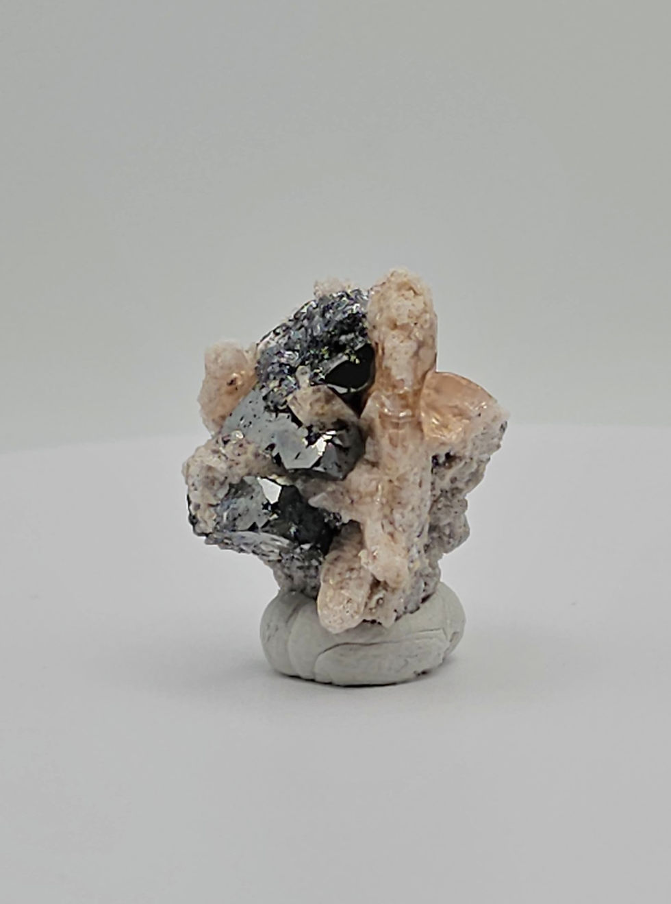 Thumbnail: Bixbyite and Topaz in Rhyolite Matrix Specimen