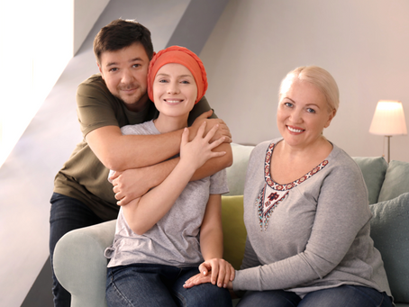 Family caregiver supporting a cancer patient at home.