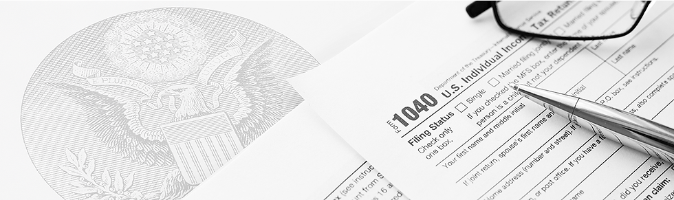 The seal of the Federal government with tax forms beside it
