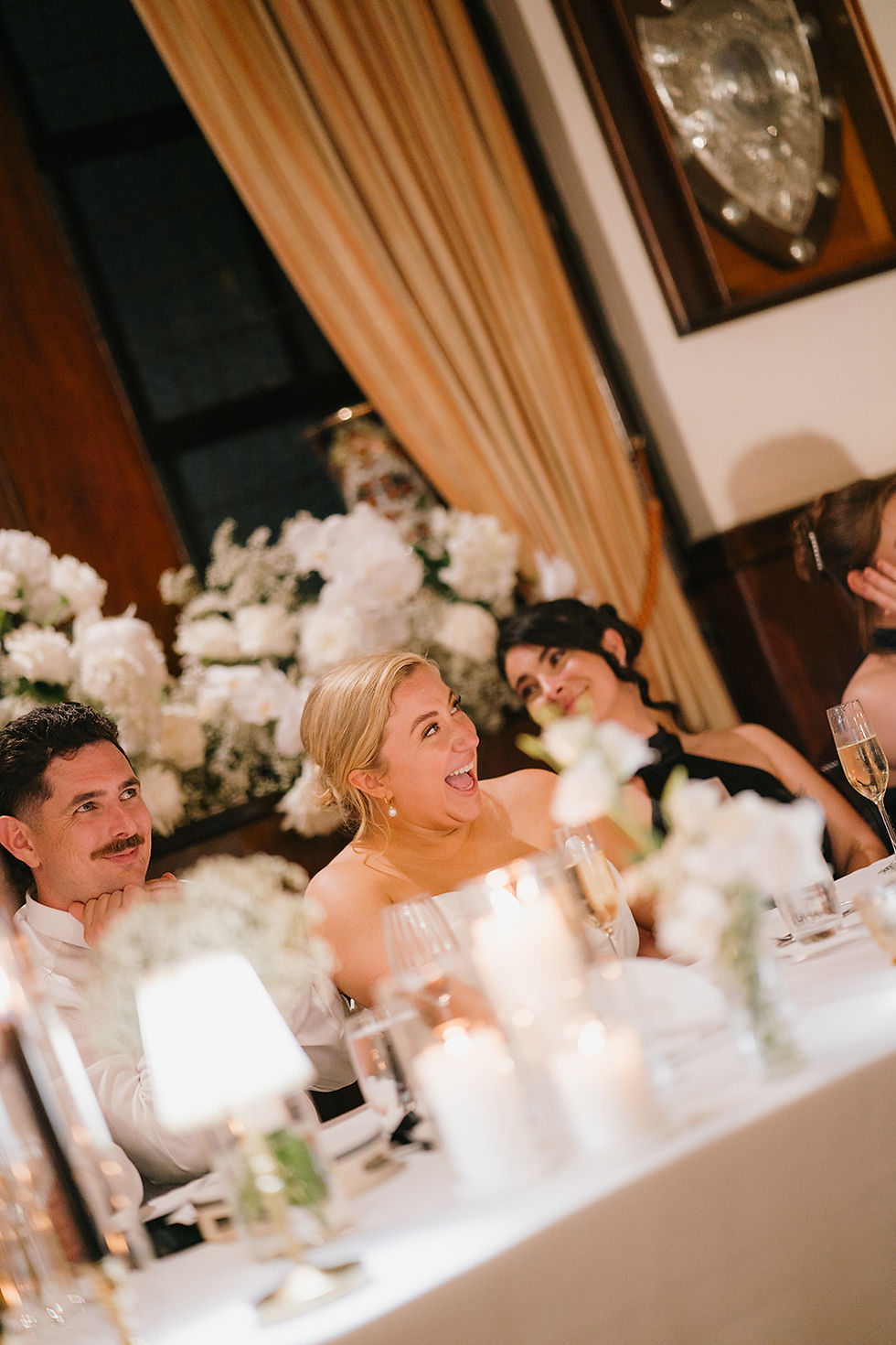 bride and groom enjoying the reception at beautiful set up bridal table at RACA, styling by Fable Studio Co