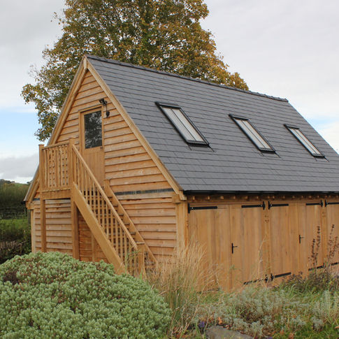 Oak garage with first floor and velux windows