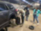 Girl changing car tire
