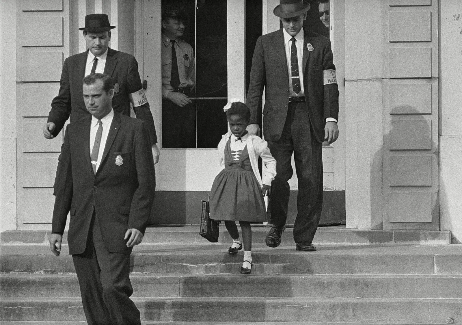US-deputy-marshals-escort-Ruby-Bridges-from-William-Frantz-Elementary-School-New-Orleans-N