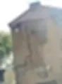 The side of a building with neatly arranged cables and routing.