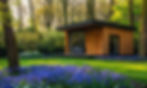 vecteezy_a-serene-modern-wooden-cabin-surrounded-by-a-lush-carpet-of_43033854.jpg