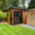 home garden office pod in a nice garden