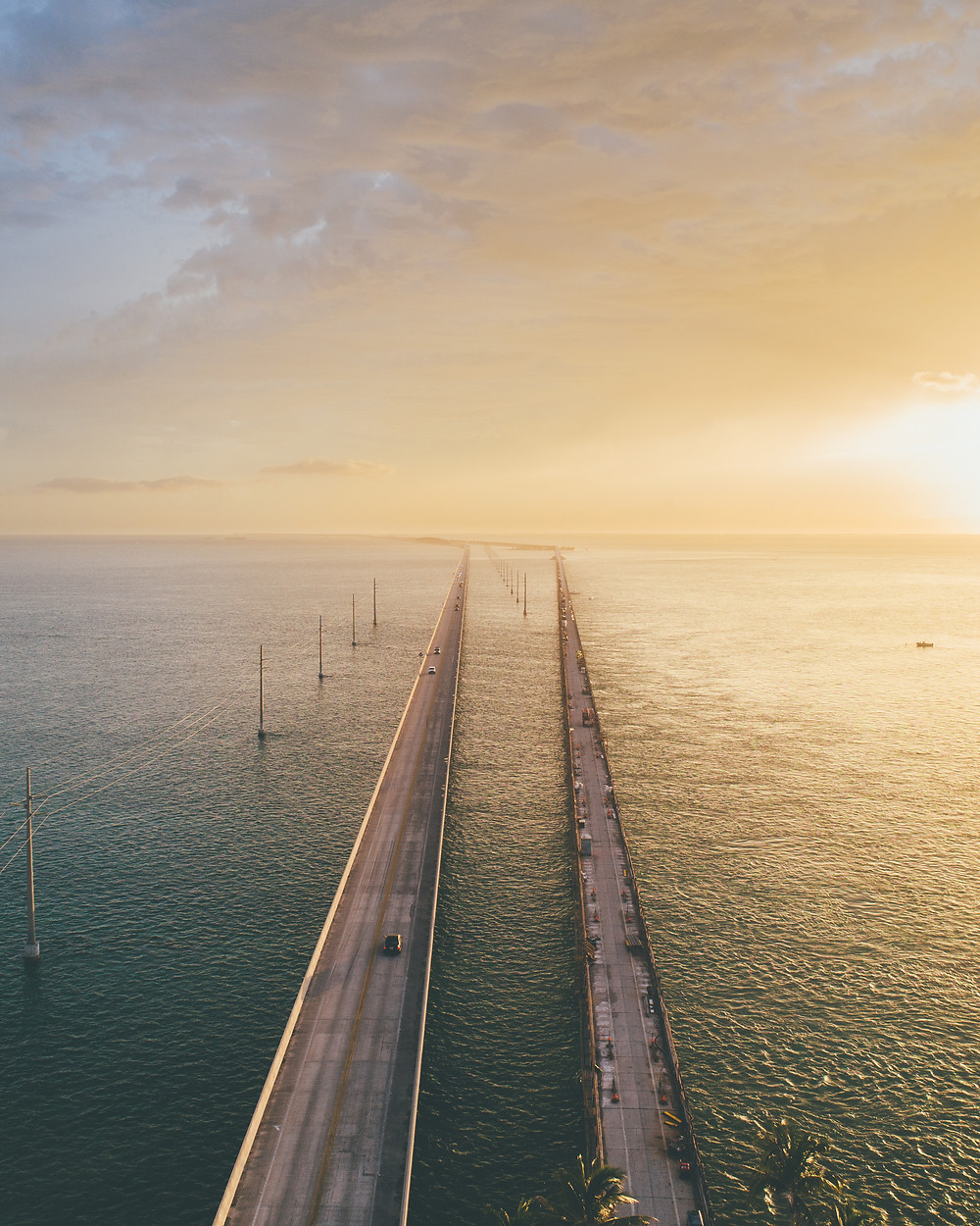 Drone picture of a bridge at sunset in the florida keys by pierce gainey
