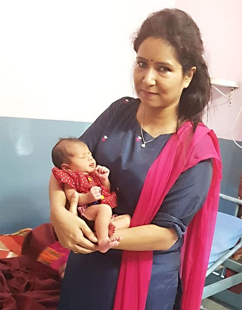 Dr Sabita Dixit with a newborn 