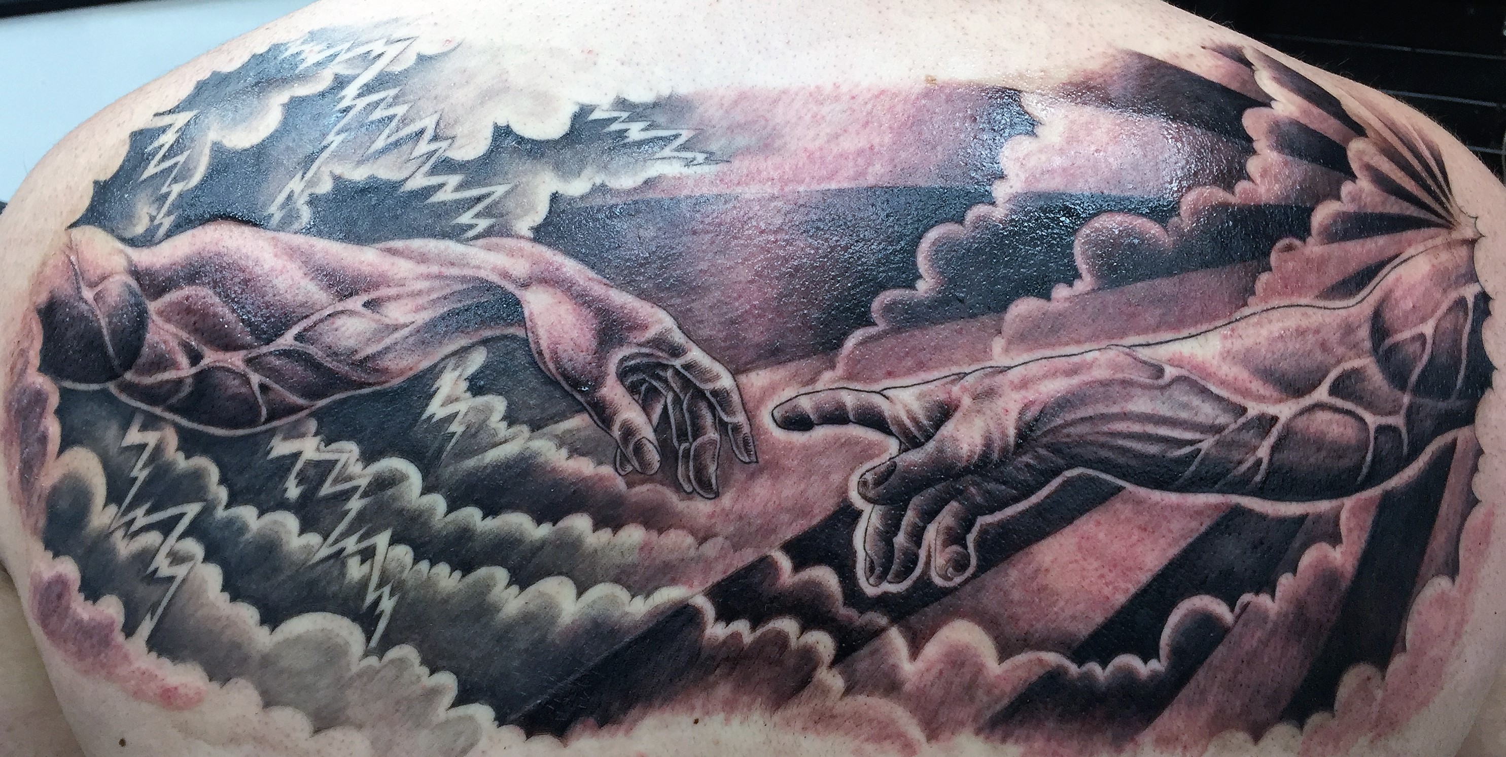 creation of man tattoo