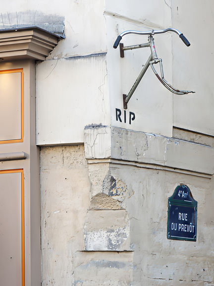 Wall with street sign and graffiti art.