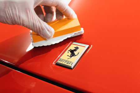 Ceramic coating a red Ferrari bonnet