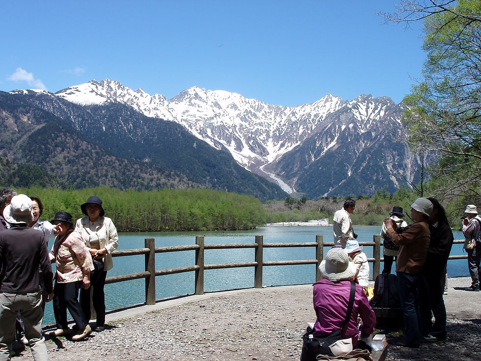 Taisho Pond reflecting the snow-capped Northern Alps. Easy walking in casual wear and sneakers.