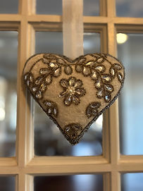 A picture of an ornate heart shaped piece of art.