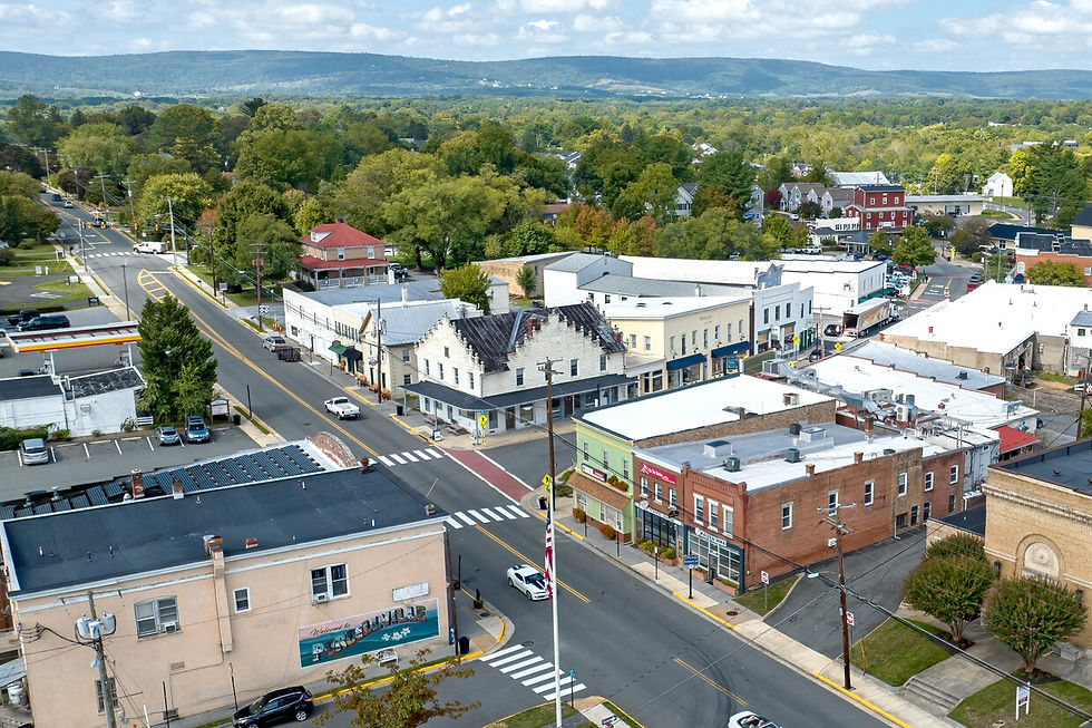 Downtown Purcellville from above, Main Street running east-west through the heart of town with the Blue Ridge holding the western horizon five minutes from Blue Sky Farm.