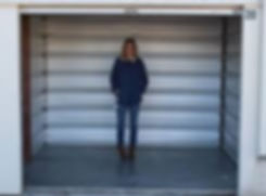 sherry-facing-forward-in-a-large-storage-bay.jpg