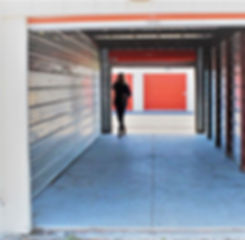 sherry-standing-in-a-storage-unit-with-doors-on-each-end.jpg