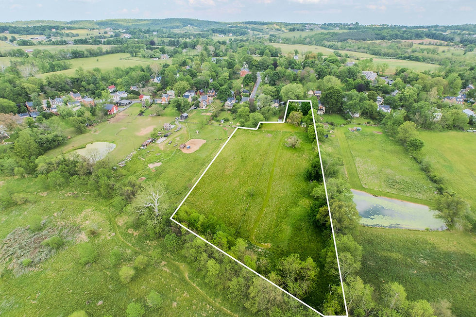 A wider view of the same parcel, set in the context of the Village of Waterford at the upper left and the open, permanently protected acreage of the Phillips Farm extending to the south. The Phillips Farm, owned by the Waterford Foundation, is protected in perpetuity and ensures that the long view from the rear of the property will not change.