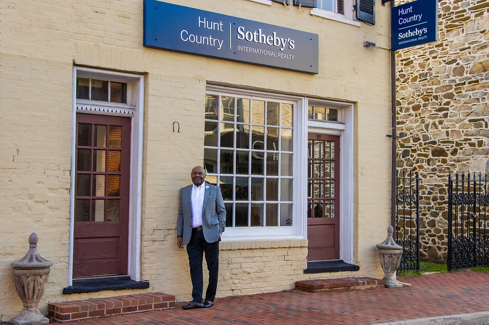 Bryan Crittenton outside the Hunt Country Sotheby's International Realty office at 22 West Market Street in the heart of Historic Downtown Leesburg — where client conversations happen against the backdrop of one of Northern Virginia's most storied communities. A second office in Middleburg extends that same standard of service deeper into Virginia's horse country.