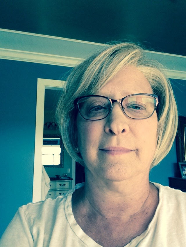 Purcellville Realtor Geri Deane courageously shares her personal journey with follicular lymphoma. In this photo she is wearing a wig after shaving her head during chemotherapy.