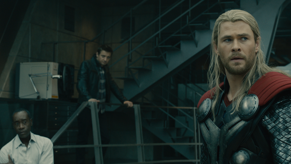 Rhodey (Don Cheadle), Clint (Jeremy Renner) and Thor (Chris Hemsworth) aren't too pleased with what they hear in Avengers: Age of Ultron