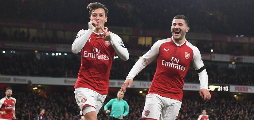 Mesut Ozil celebrates scoring for Arsenal