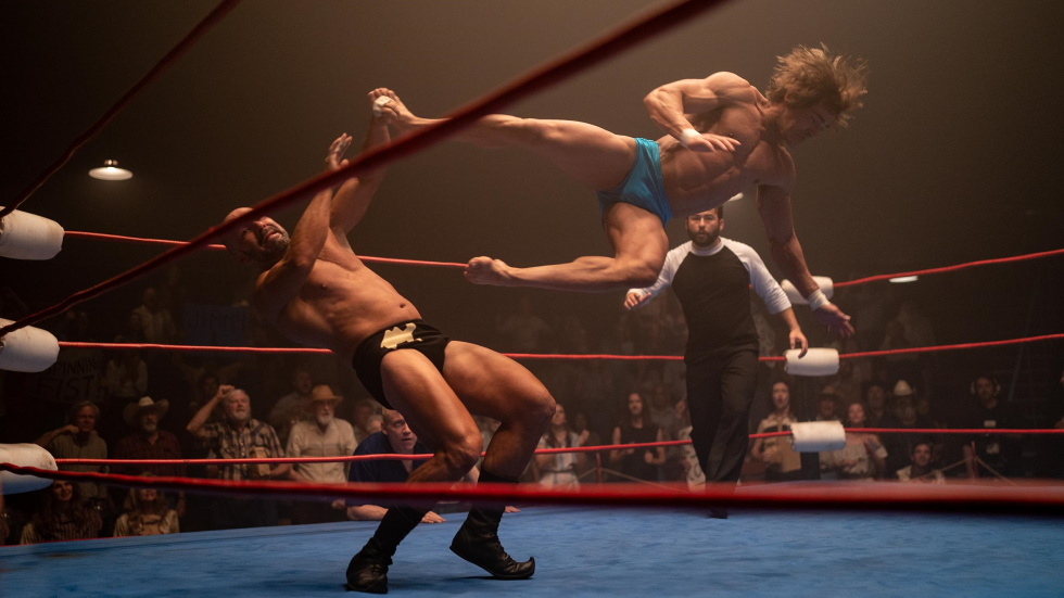 Kevin Von Erich (Zac Efron) dropkicks The Sheikh (Chavo Guerrero Jr.) during a match - from The Iron Claw