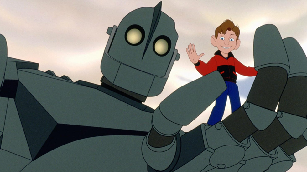 The Iron Giant (Vin Diesel) holding Hogarth (Eli Marienthal) in his hand - from The Iron Giant