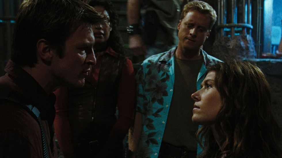 Mal (Nathan Fillion) and Kaylee (Jewel Staite) argue in front of Zoë (Gina Torres) and Wash (Alan Tudyk) in Serenity