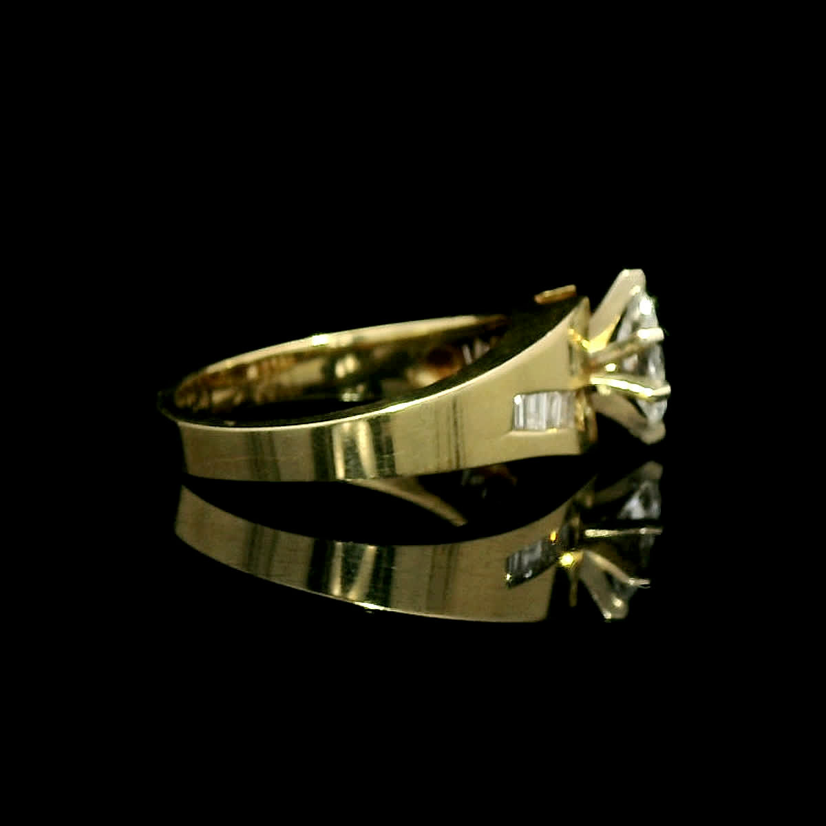 Marquise Diamond Solitaire Ring in Yellow Gold with Channel-Set Accents