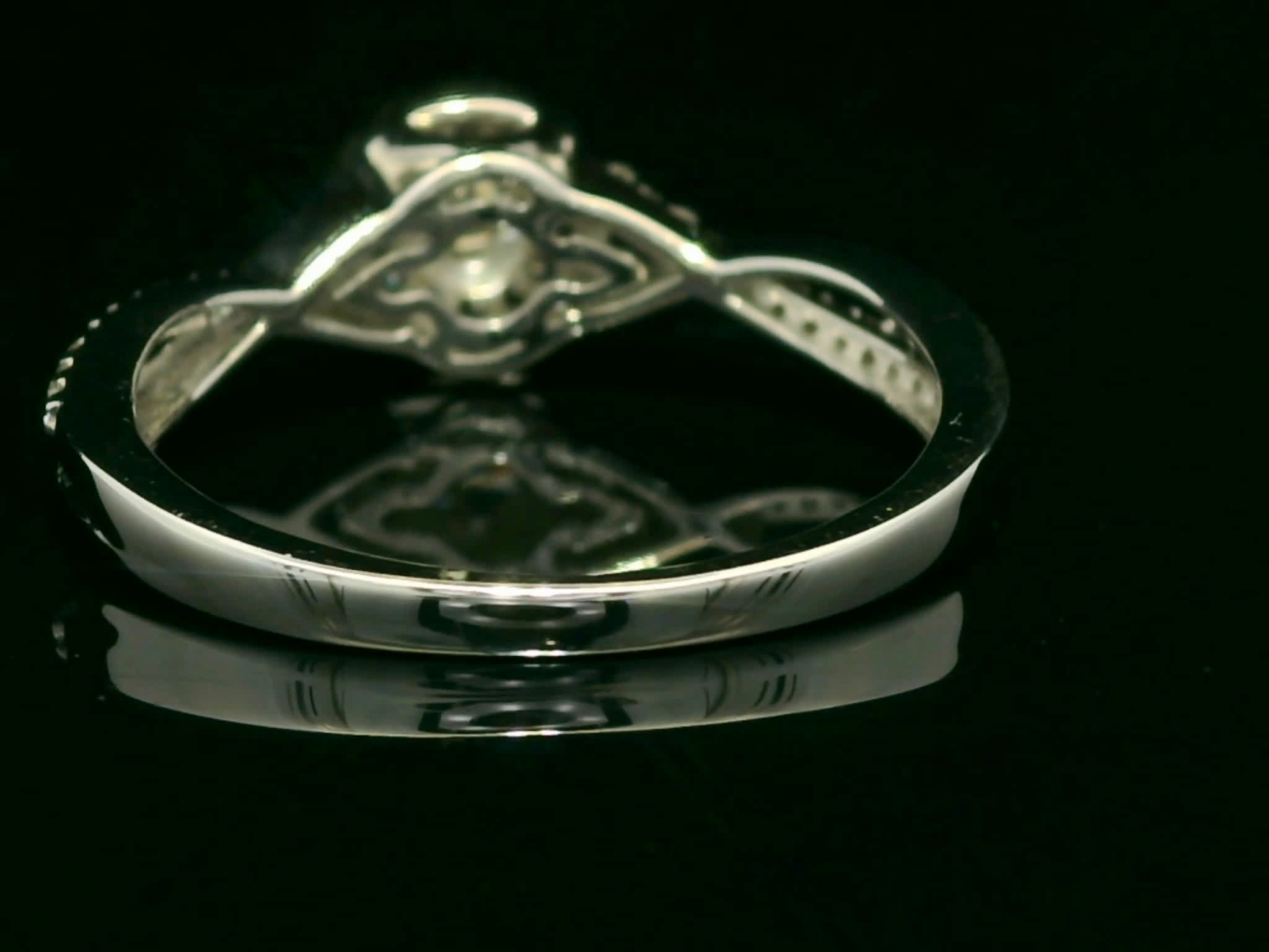Round Brilliant Diamond Halo Split Shank Intertwined Ring in White Gold