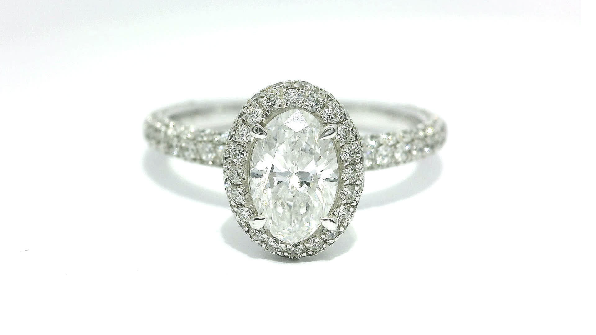Oval Brilliant Cut Diamond Halo Engagement Ring in White Gold