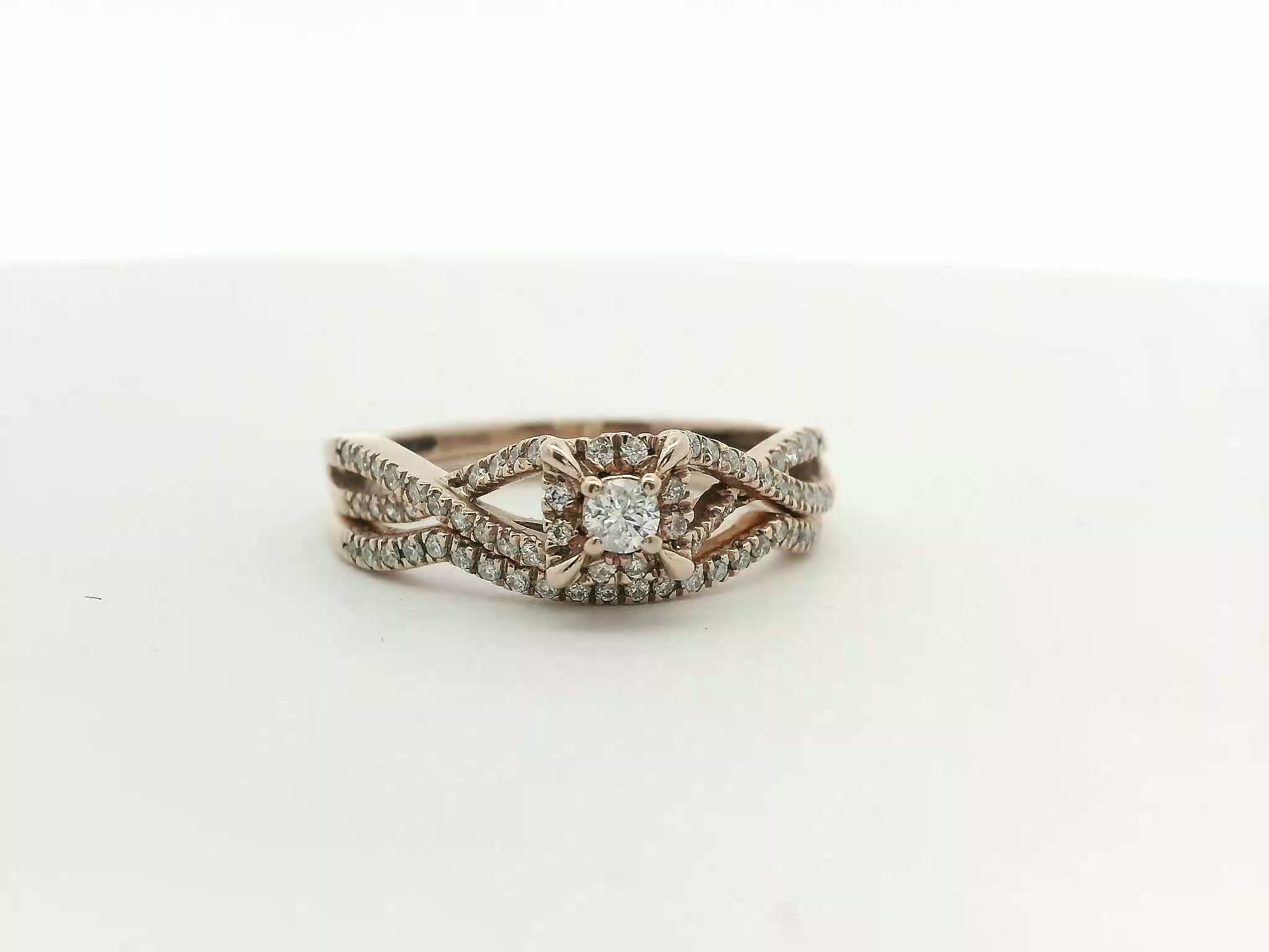 Rose Gold Round Brilliant Diamond Twist Halo Engagement Ring